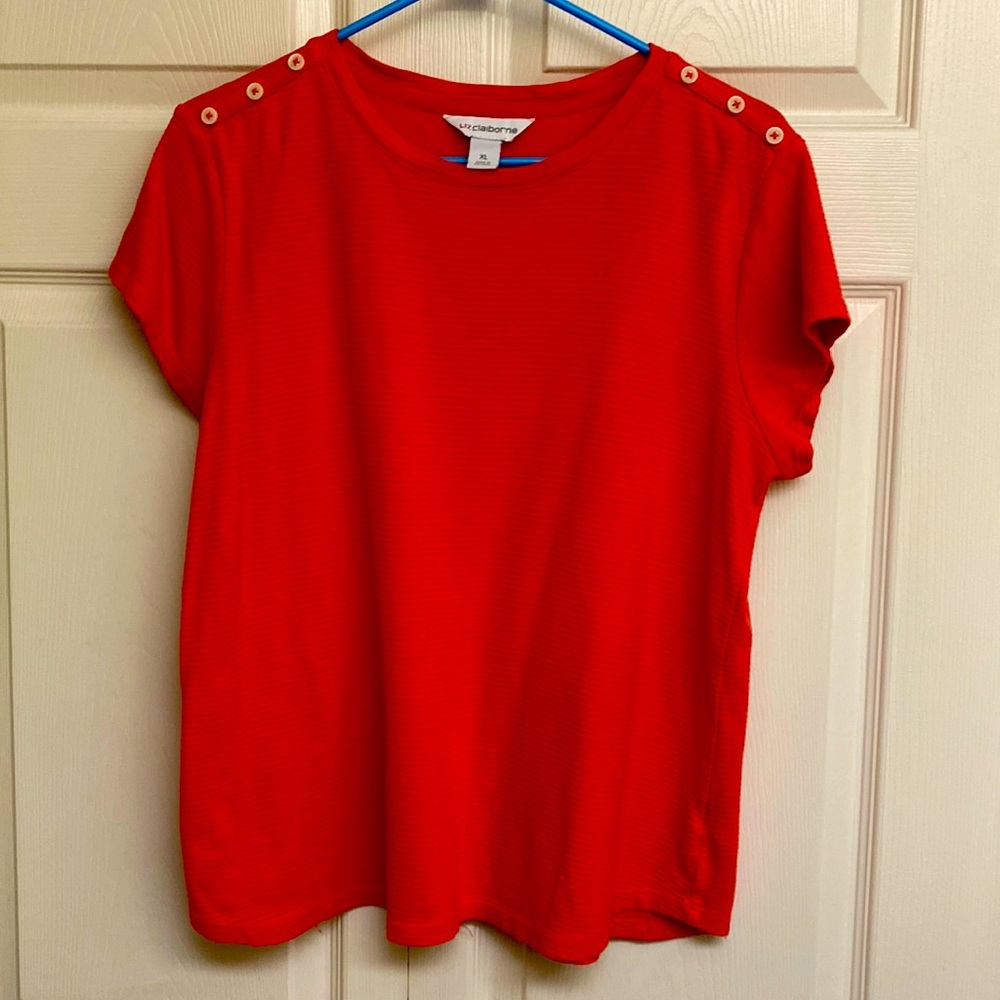 Orange top with decorative shoulder buttons